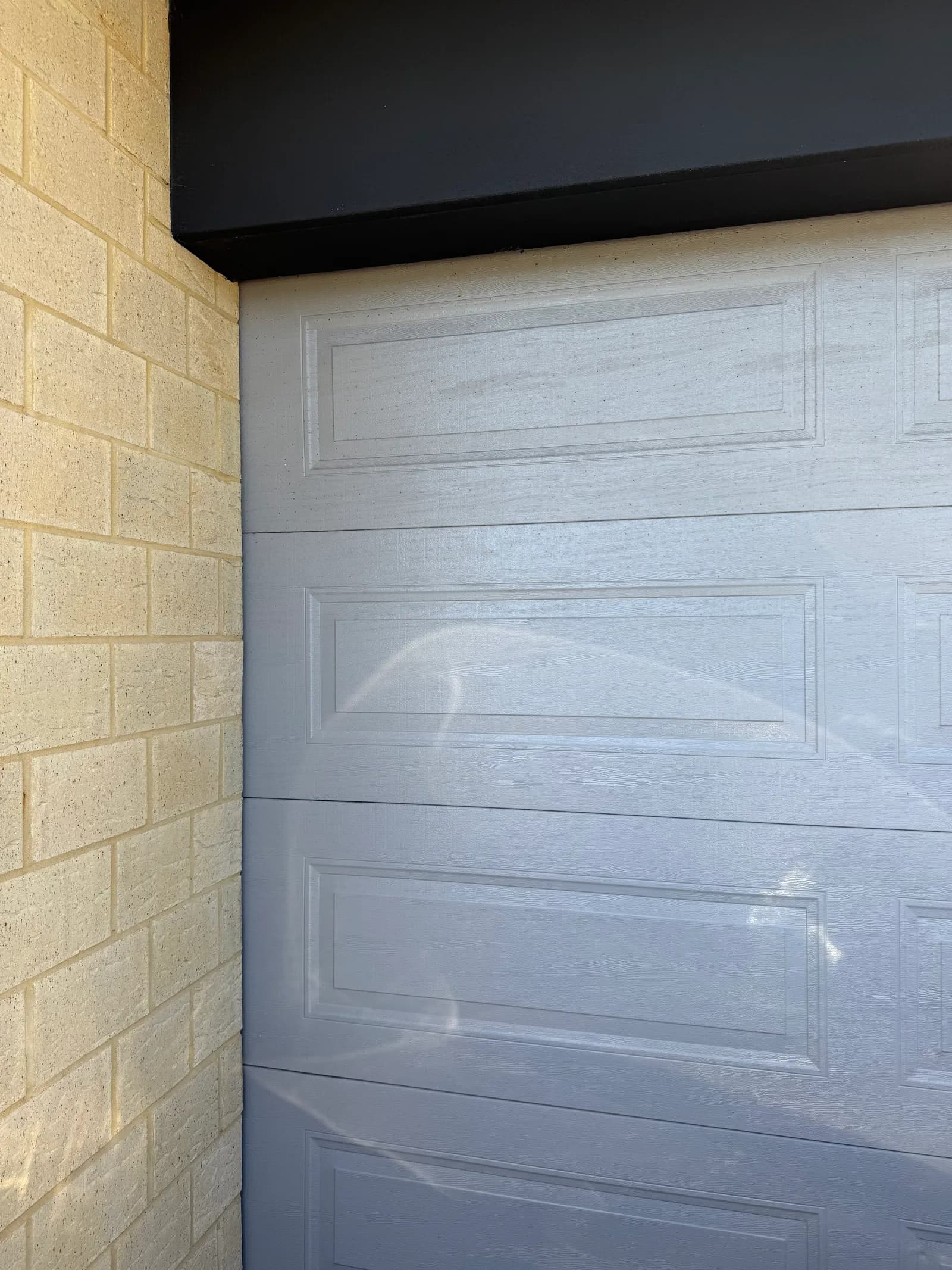 White sectional garage door in Willetton after cable and bottom-bracket replacement White sectional garage door in Willetton after cable and bottom-bracket replacement