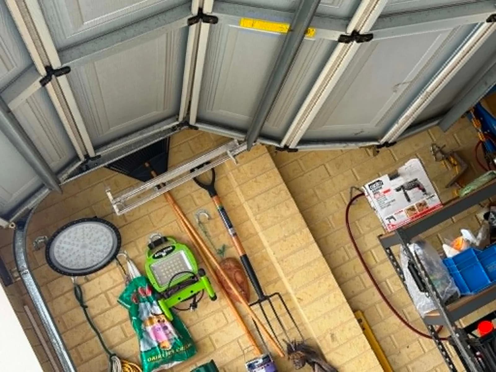 Sectional garage door in Secret Harbour, Perth with its top panels sagging off the horizontal track, stuck part-open Sectional garage door in Secret Harbour, Perth with its top panels sagging off the horizontal track, stuck part-open