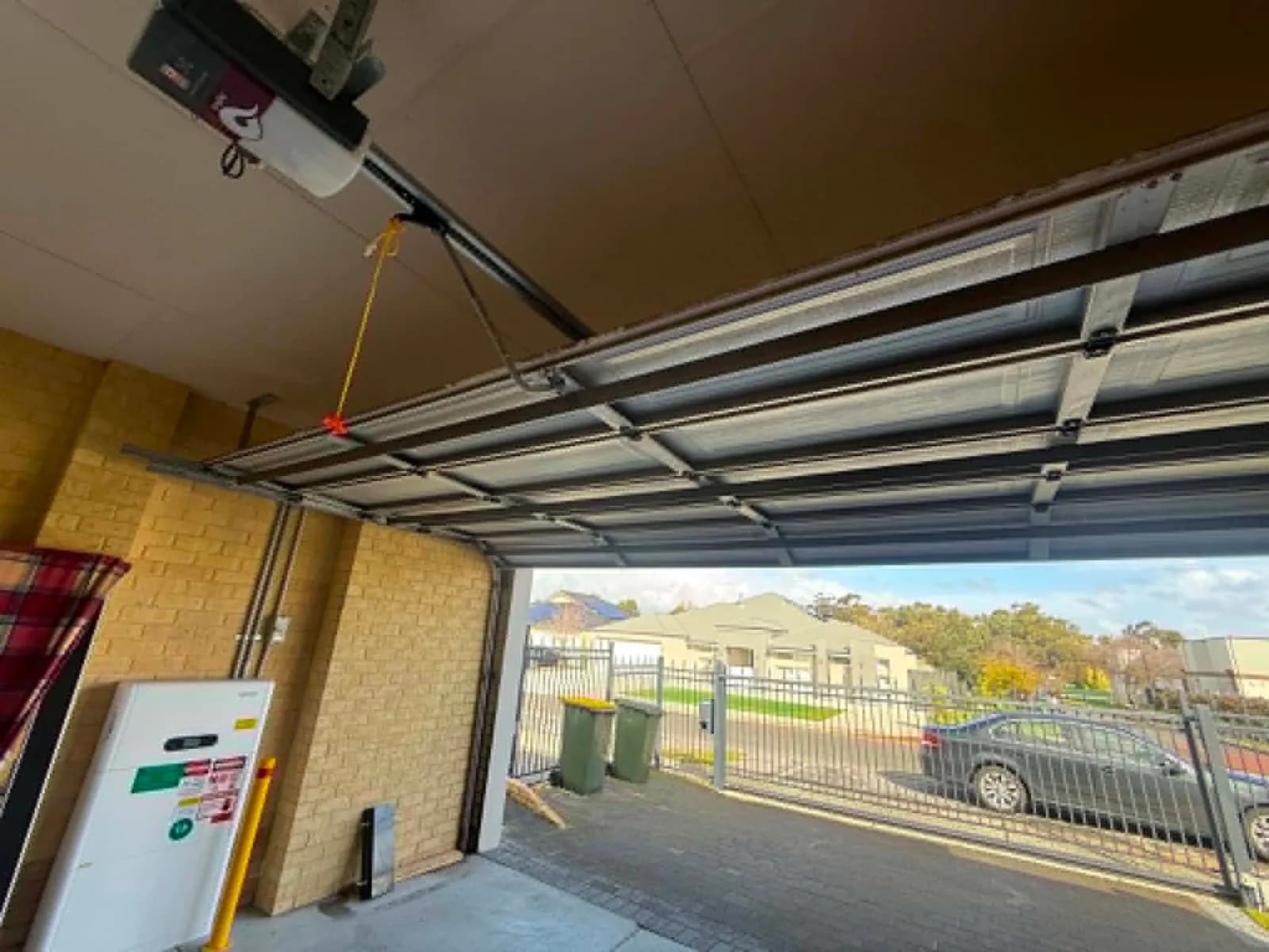 The same sectional garage door in Secret Harbour, Perth open and running normally on its opener after being re-tracked The same sectional garage door in Secret Harbour, Perth open and running normally on its opener after being re-tracked