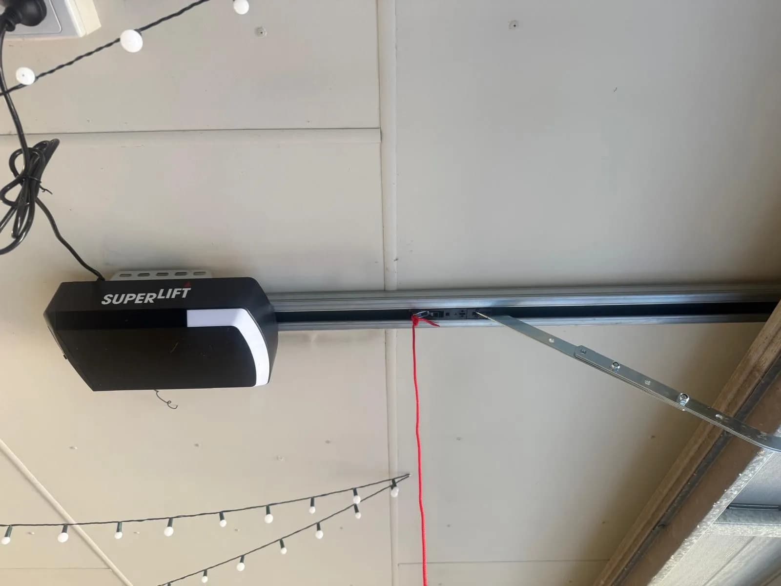 New Superlift garage door opener installed on the ceiling rail of a sectional door in Aveley, Perth New Superlift garage door opener installed on the ceiling rail of a sectional door in Aveley, Perth