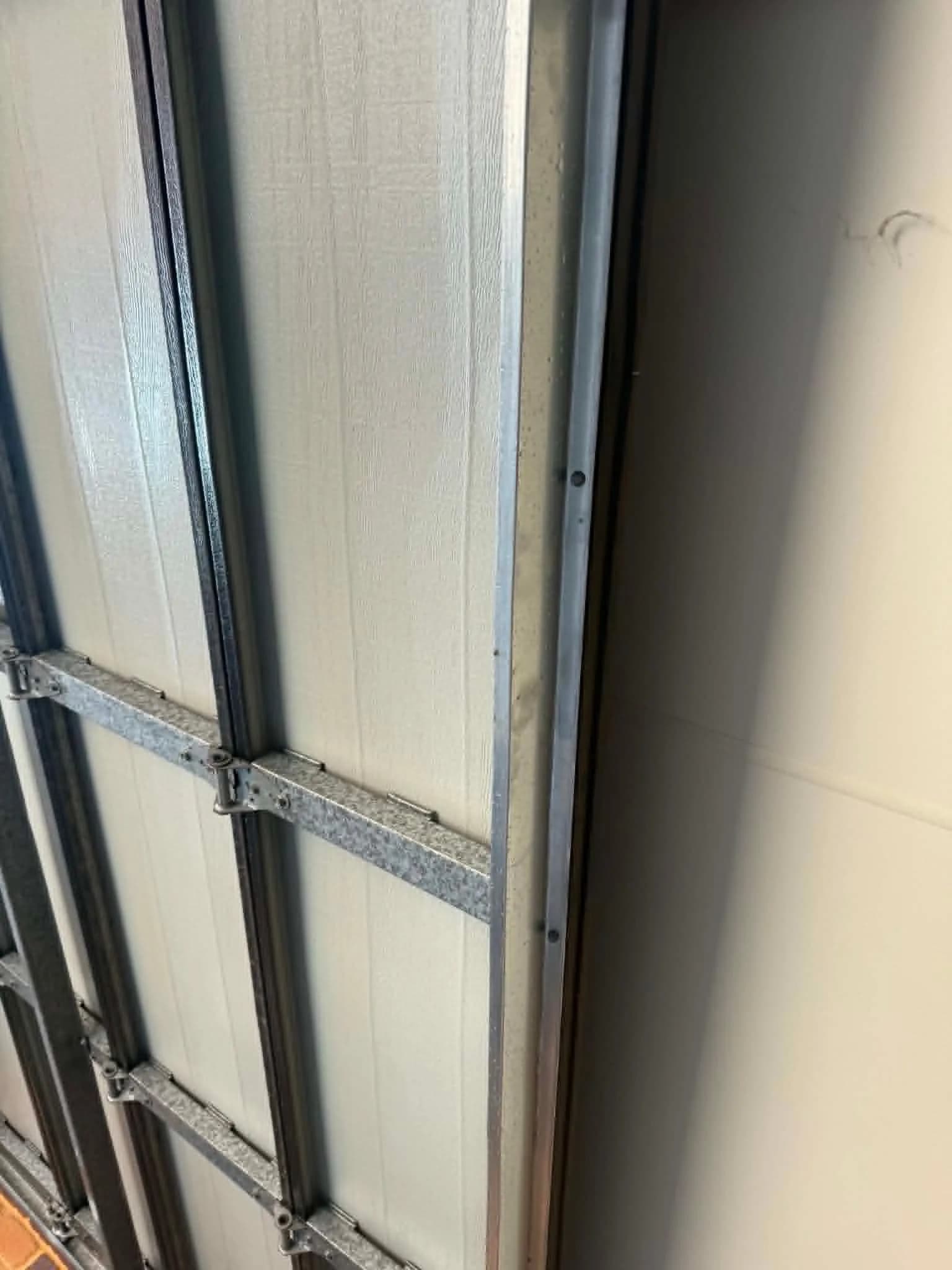 Sectional garage door re-seated in its vertical track with a new bottom bracket in Forrestfield, Perth Sectional garage door re-seated in its vertical track with a new bottom bracket in Forrestfield, Perth