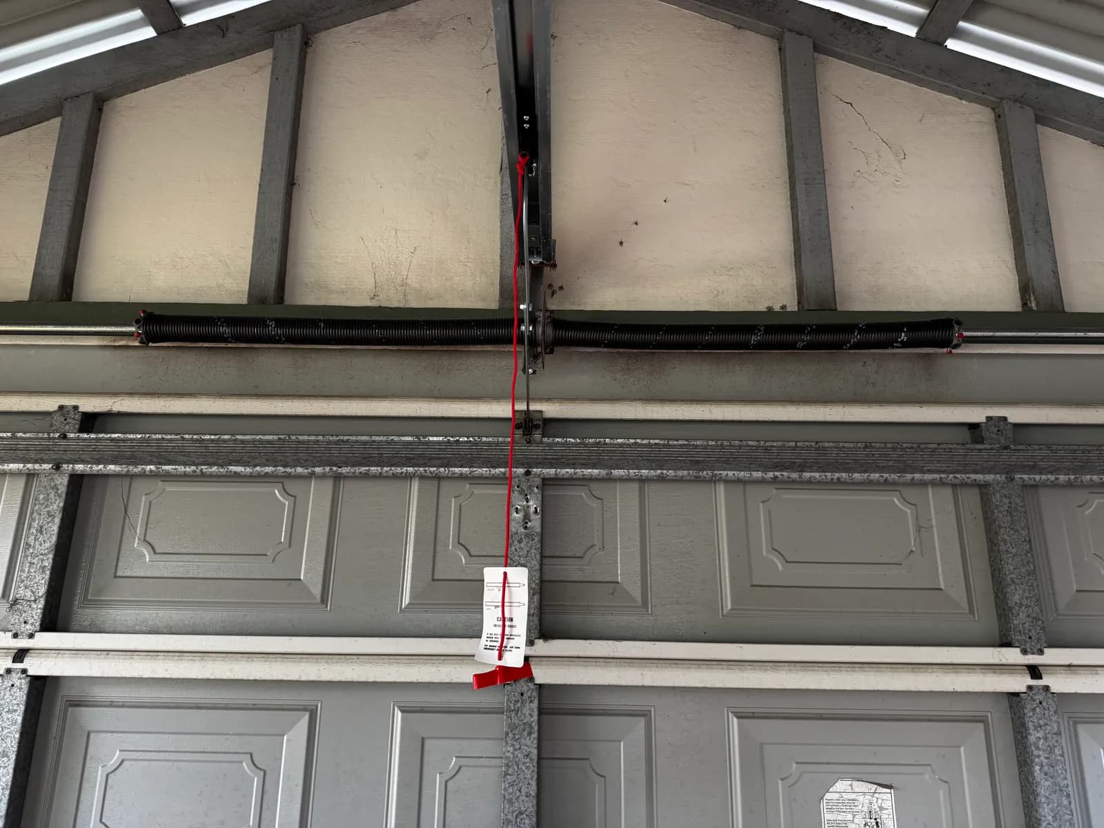 Two new torsion springs on a new torsion pipe above the Kardinya door Two new torsion springs on a new torsion pipe above the Kardinya door