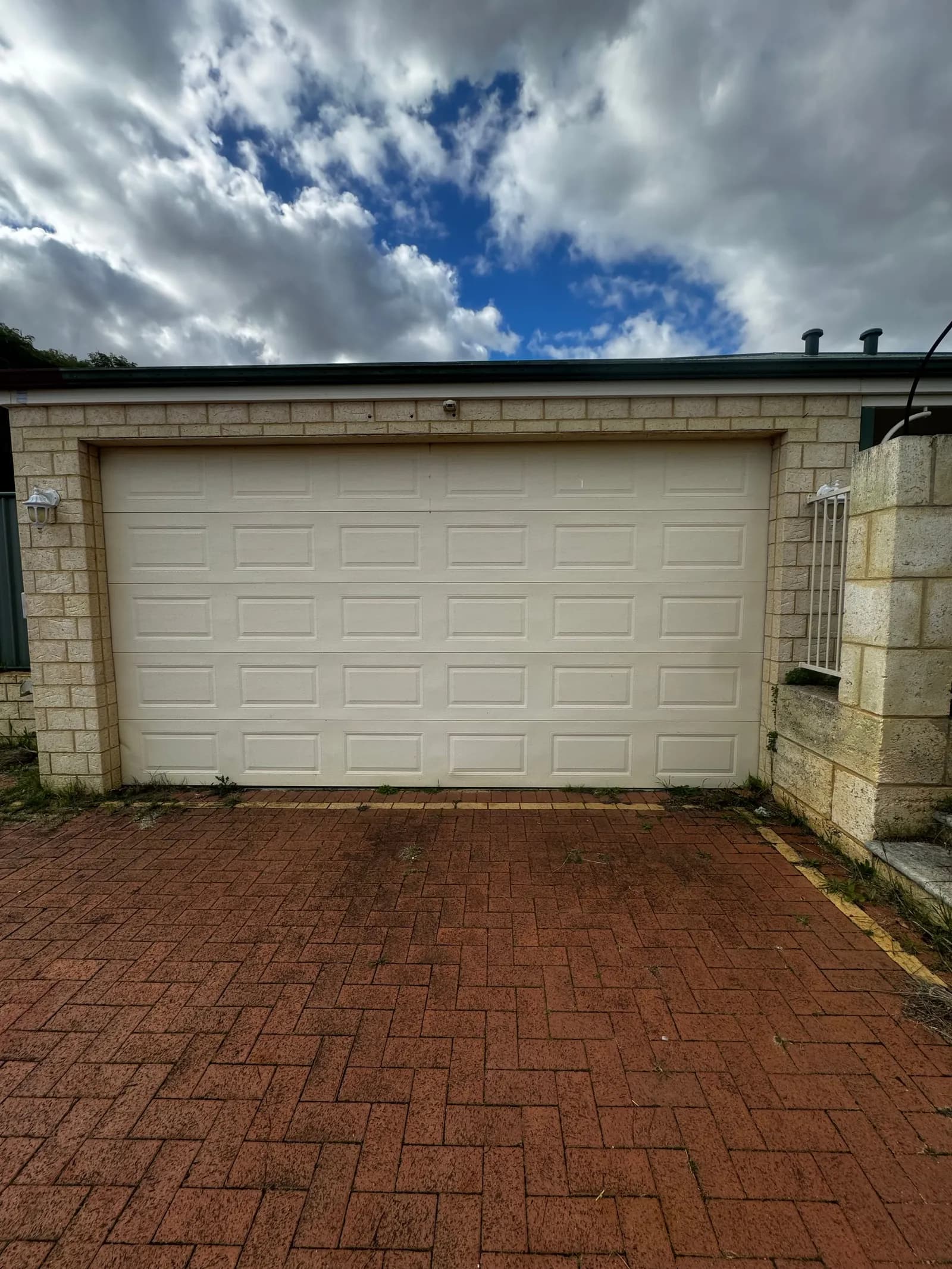 The same double sectional garage door in Jane Brook, Perth closed square and level after new cables and brackets were fitted The same double sectional garage door in Jane Brook, Perth closed square and level after new cables and brackets were fitted