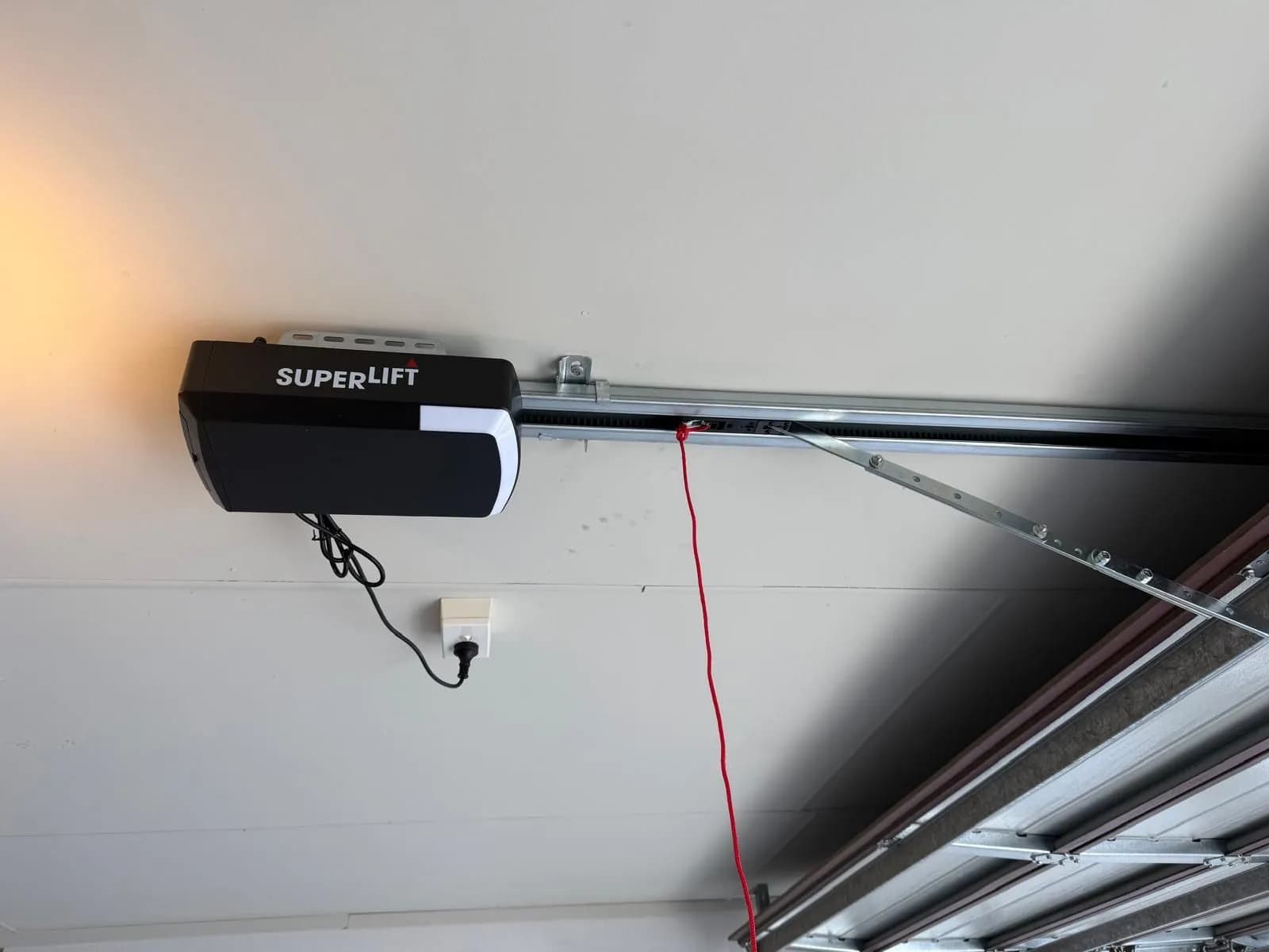 New Superlift garage door opener installed on the ceiling rail above a sectional door in Lynwood, Perth New Superlift garage door opener installed on the ceiling rail above a sectional door in Lynwood, Perth